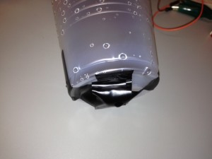 Photo showing the bottom of the inner cup with a piece of styrofoam used apply pressure directly to the pressure sensor