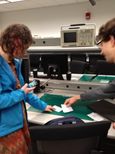 Wizard-of-Oz simulations can be challenging! Here I'm fumbling with the cards while testing on Valya