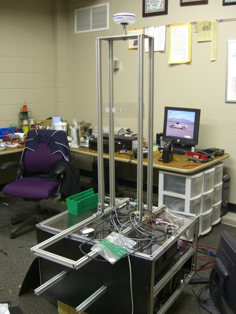 Partially constructed Argos (structure with tall sensor tower) inside of PAVE office room