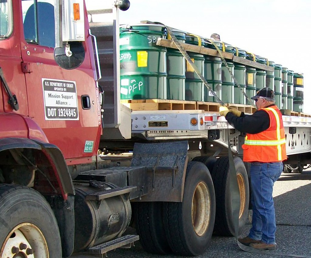 Caption: Securing a shipment of mixed, low-level waste from Hanford for treatment and disposal. Credit: U.S. Department of Energy